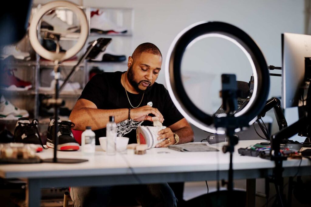 Entrepreneur photographing items for resale online ecommerce business